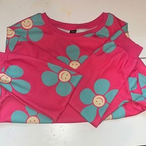 Pink sweater with blue flowers